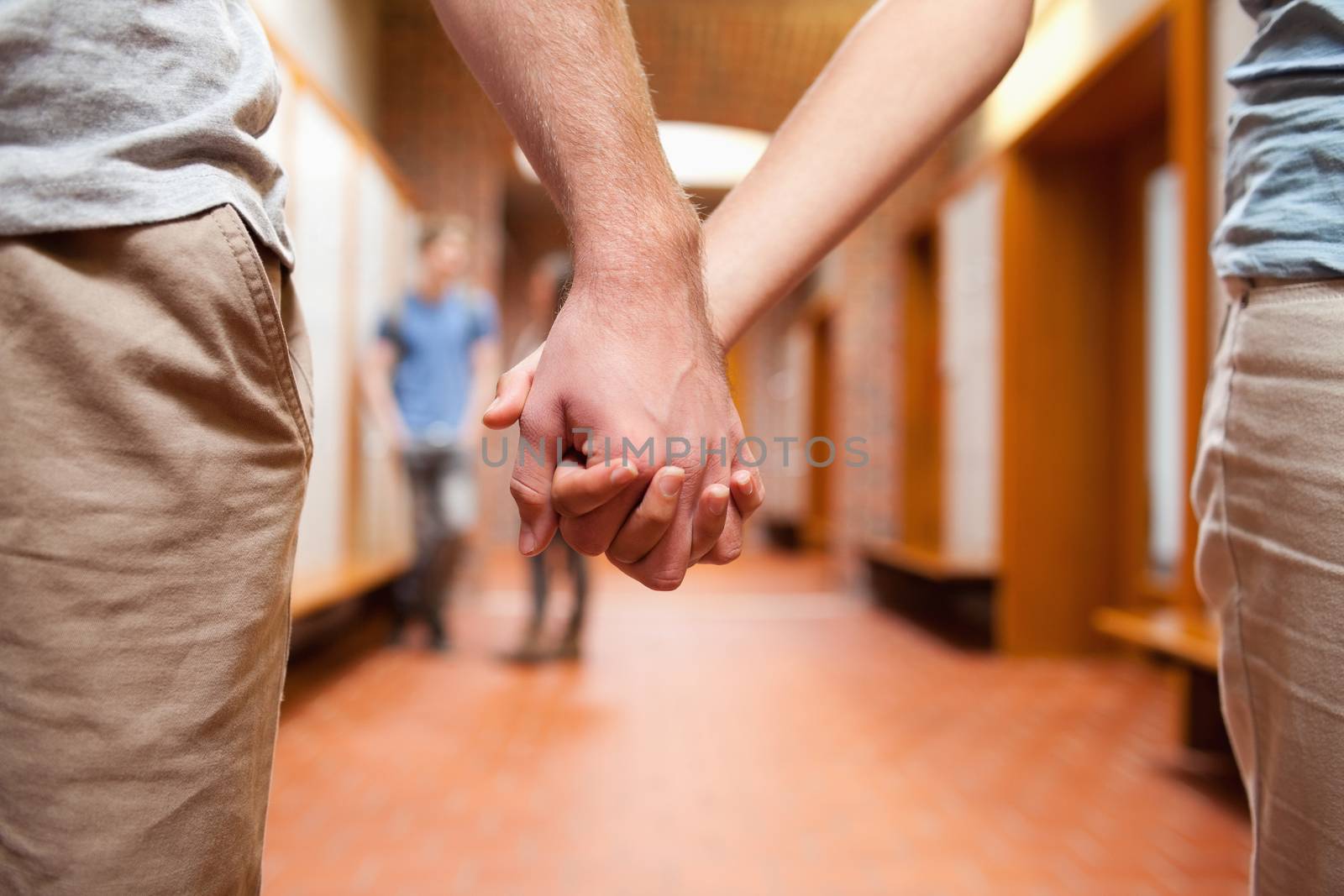 Couple holding hands by Wavebreakmedia