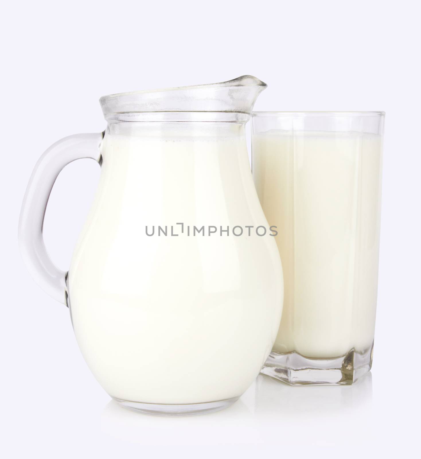 Glass jug of fresh milk isolated on white