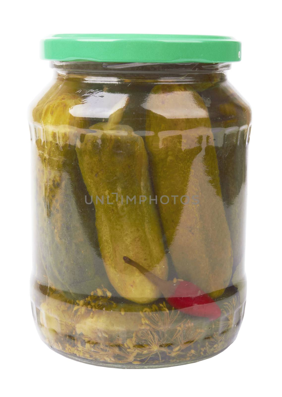 pickles in a glass jar is isolated on a white background 