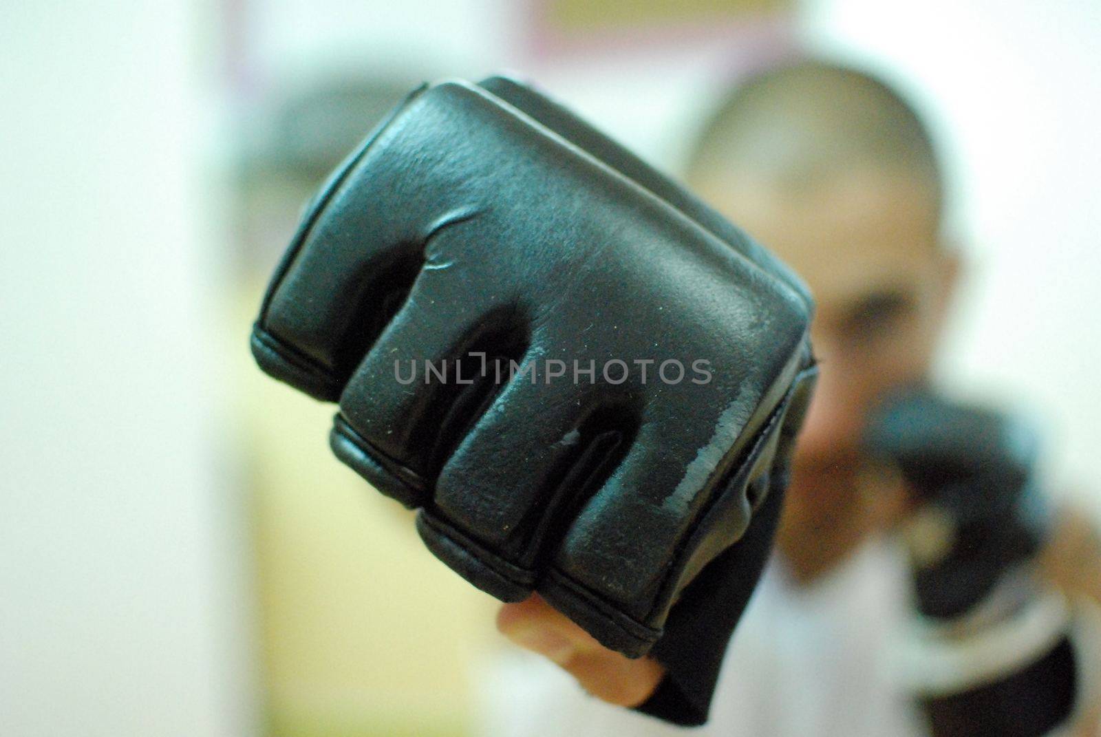 A male boxer showing his punch to the camera. This image was taken on April 2016. at New Delhi boxing club.