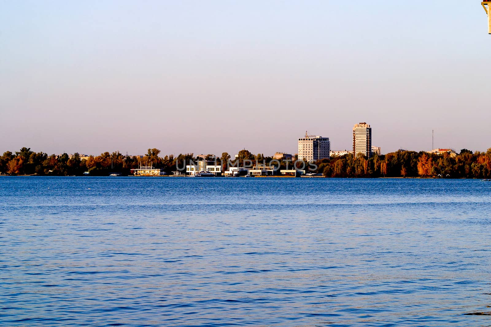 Left side of Dnipro city, Ukraine. Panoramic view of Dnipro river. Cityscape Housing estate Sunny with buildings.