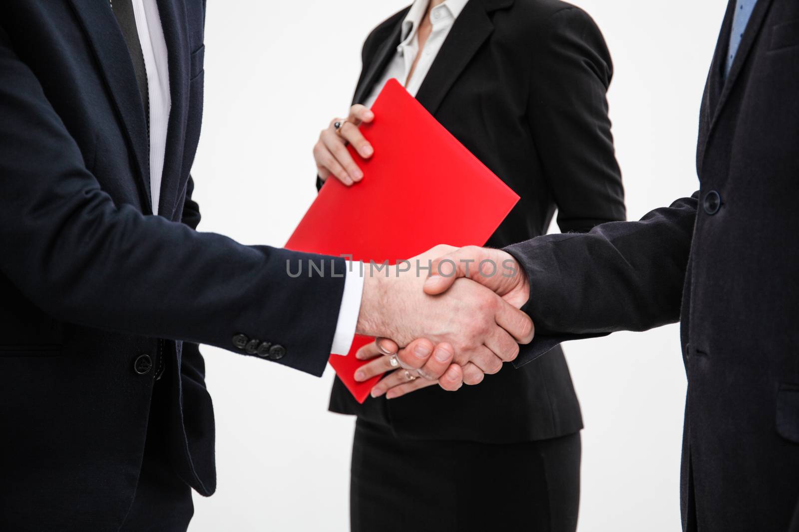 Business people shaking hands, finishing up a meeting, white background