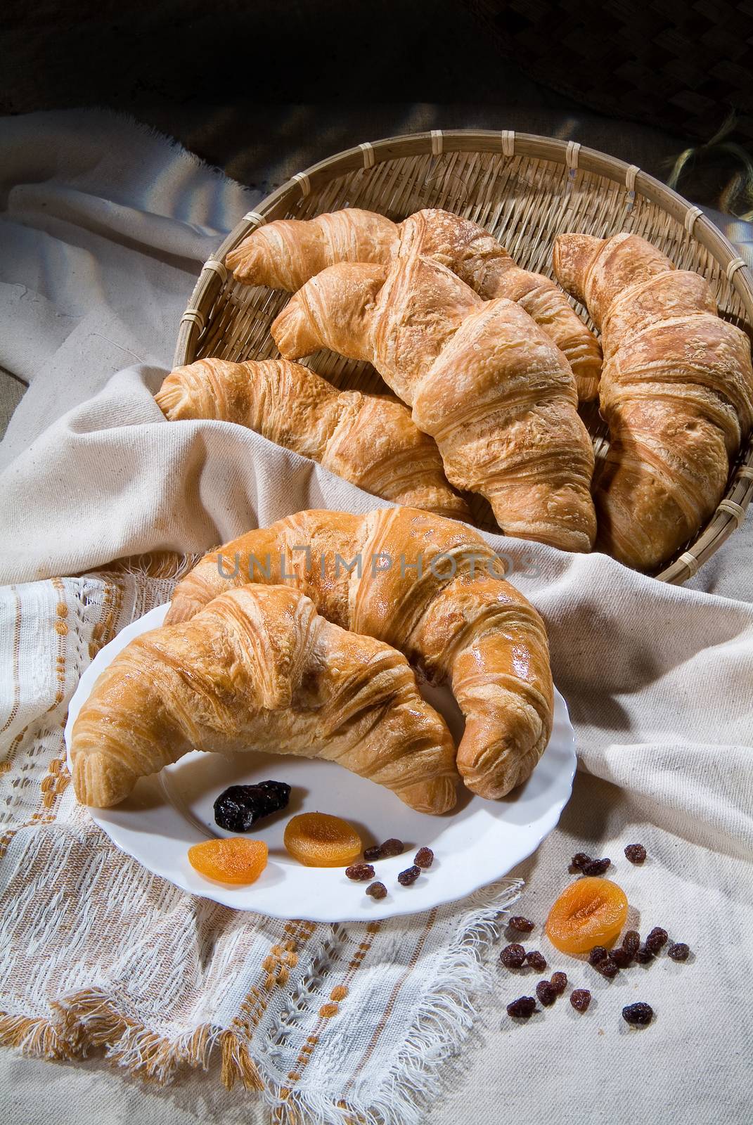 Different kinds of bread and pastry on a canvas studio background