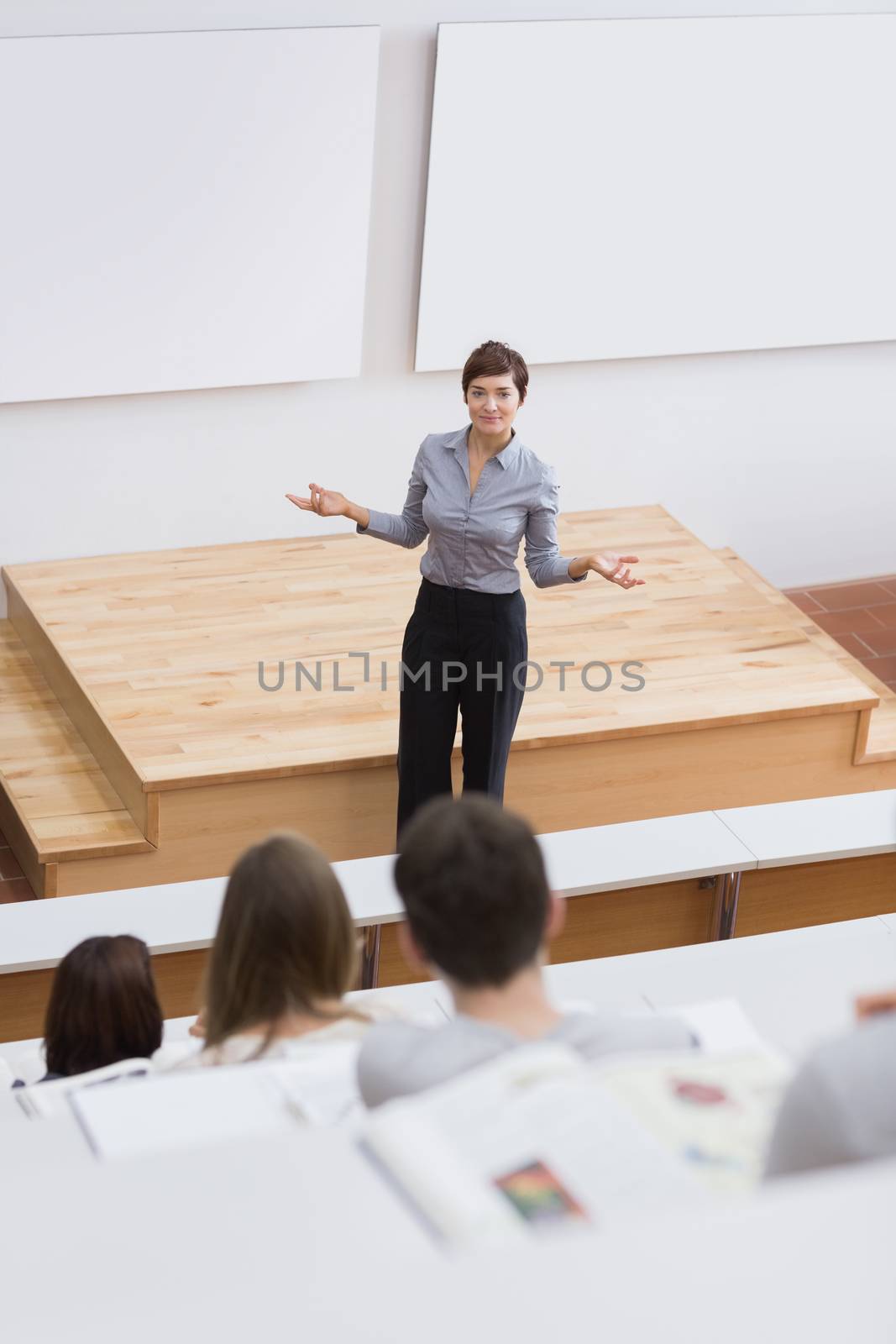 Teacher standing while talking to the students