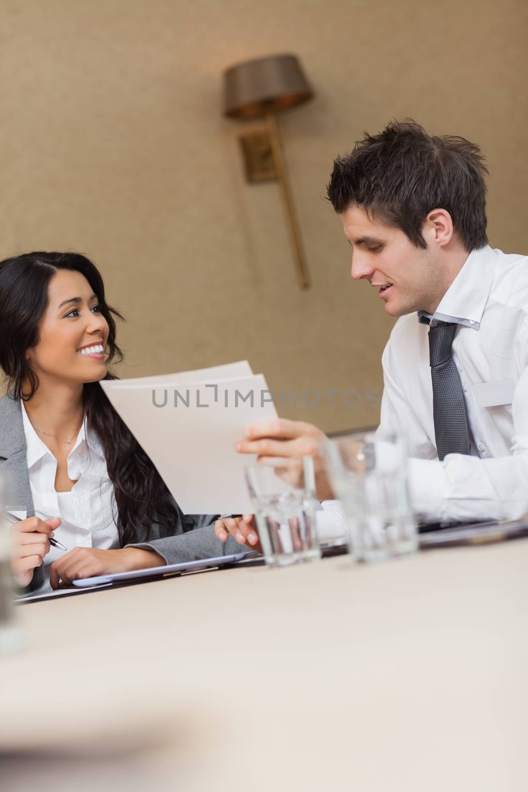 Business people speaking at meeting in conference room