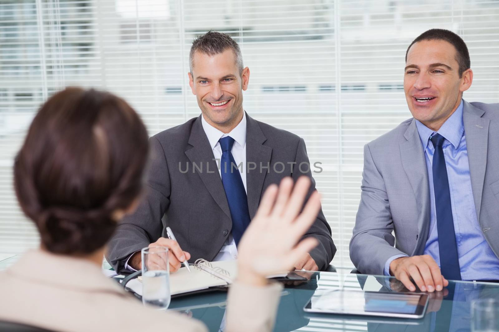Brown haired woman having an interview in bright office