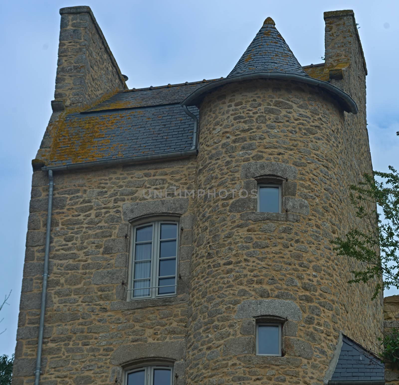 Old traditional urban stone house in Dinan, France