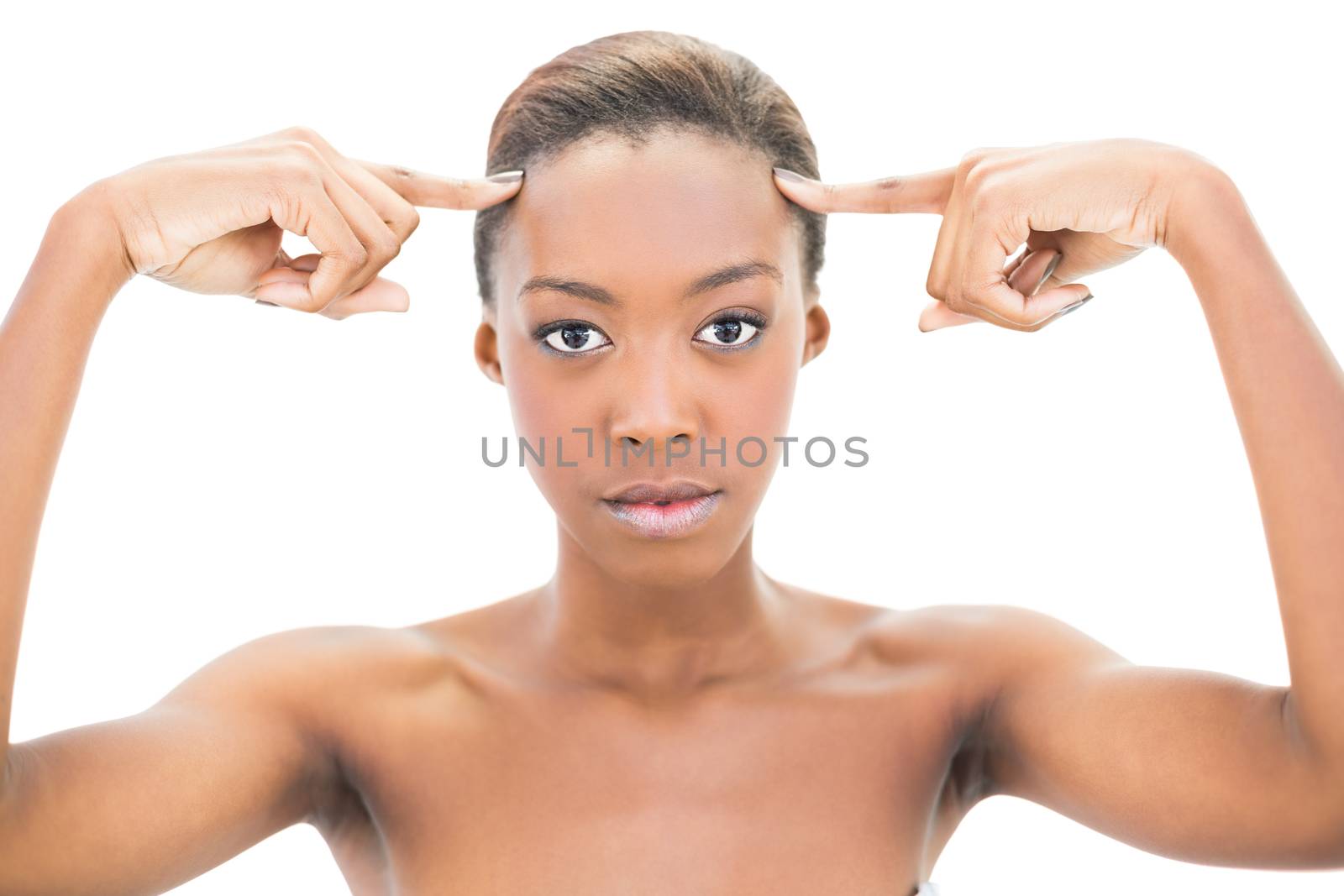 Natural beauty pointing at forehead on white background