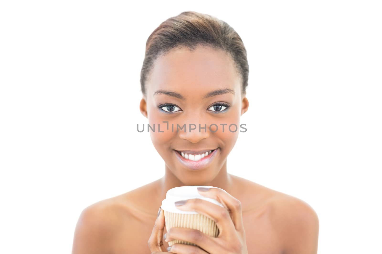 Smiling natural beauty holding coffee cup on white background