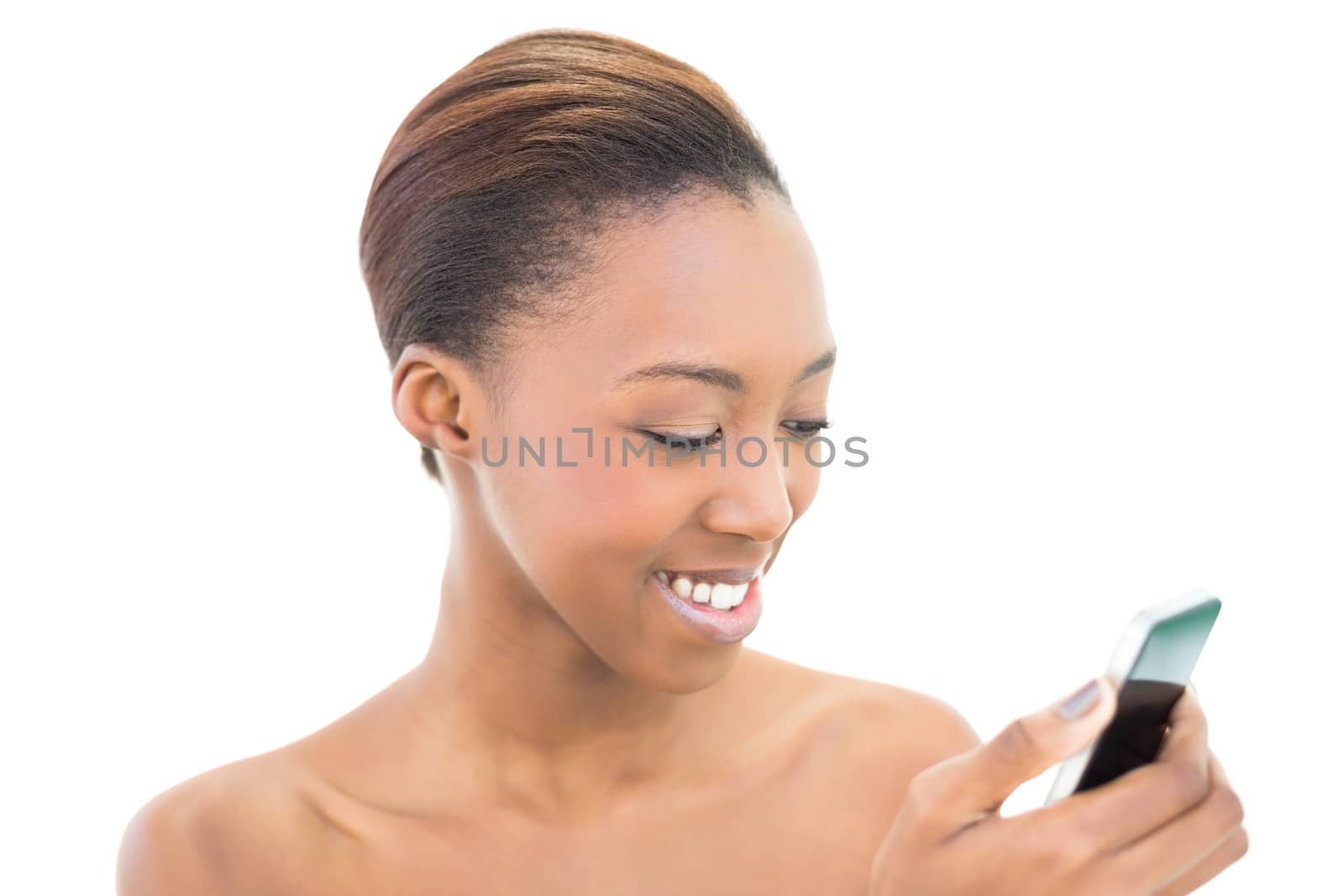 Natural beauty looking at her smartphone on white background