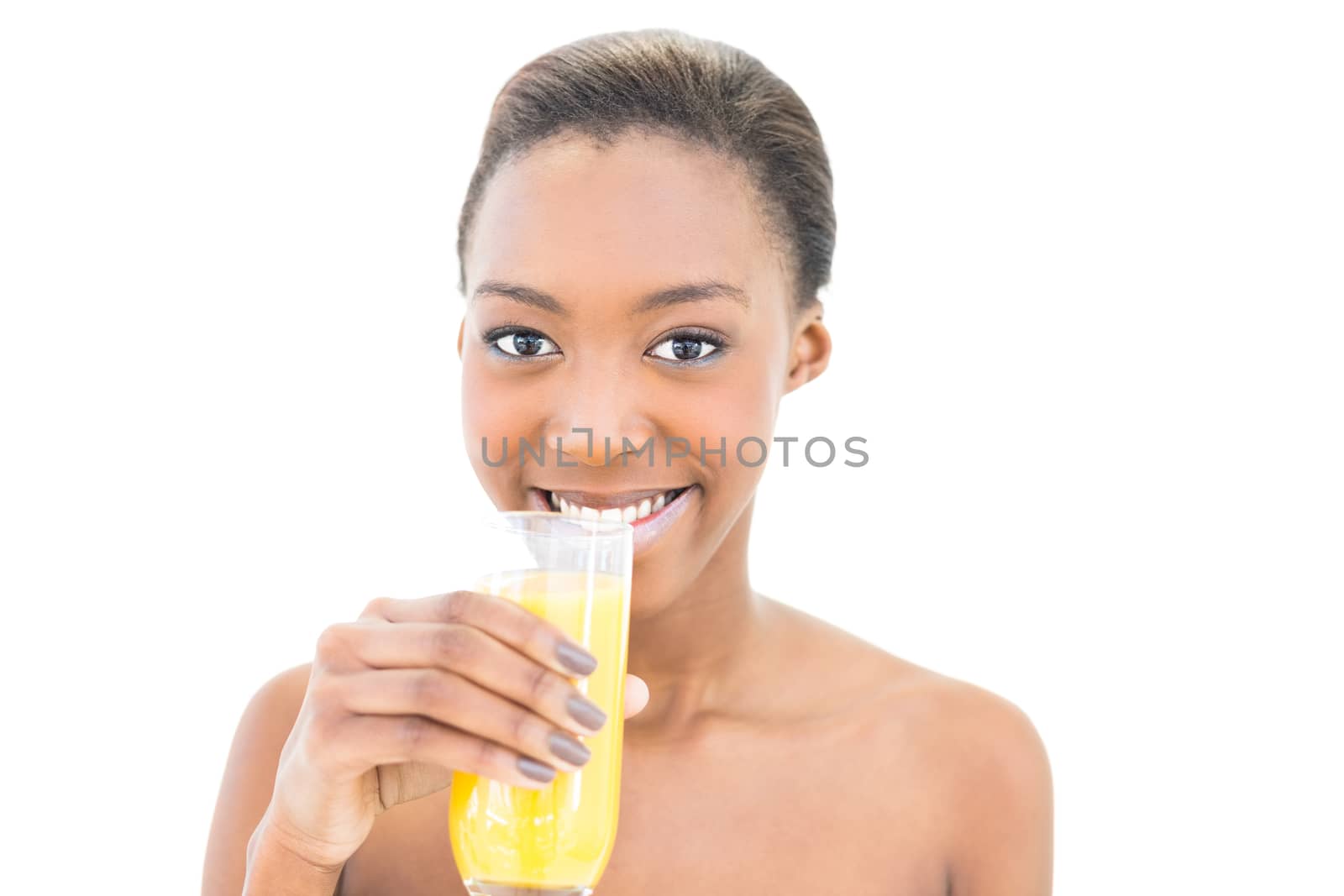 Cheerful natural beauty drinking orange juice on white background