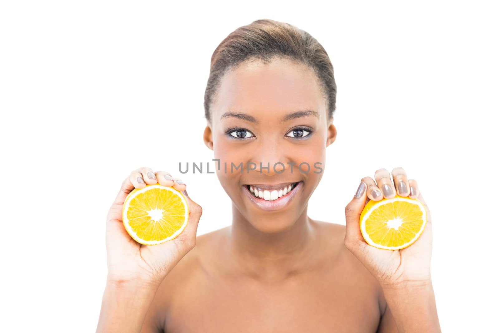 Smiling natural beauty holding orange slices on white background