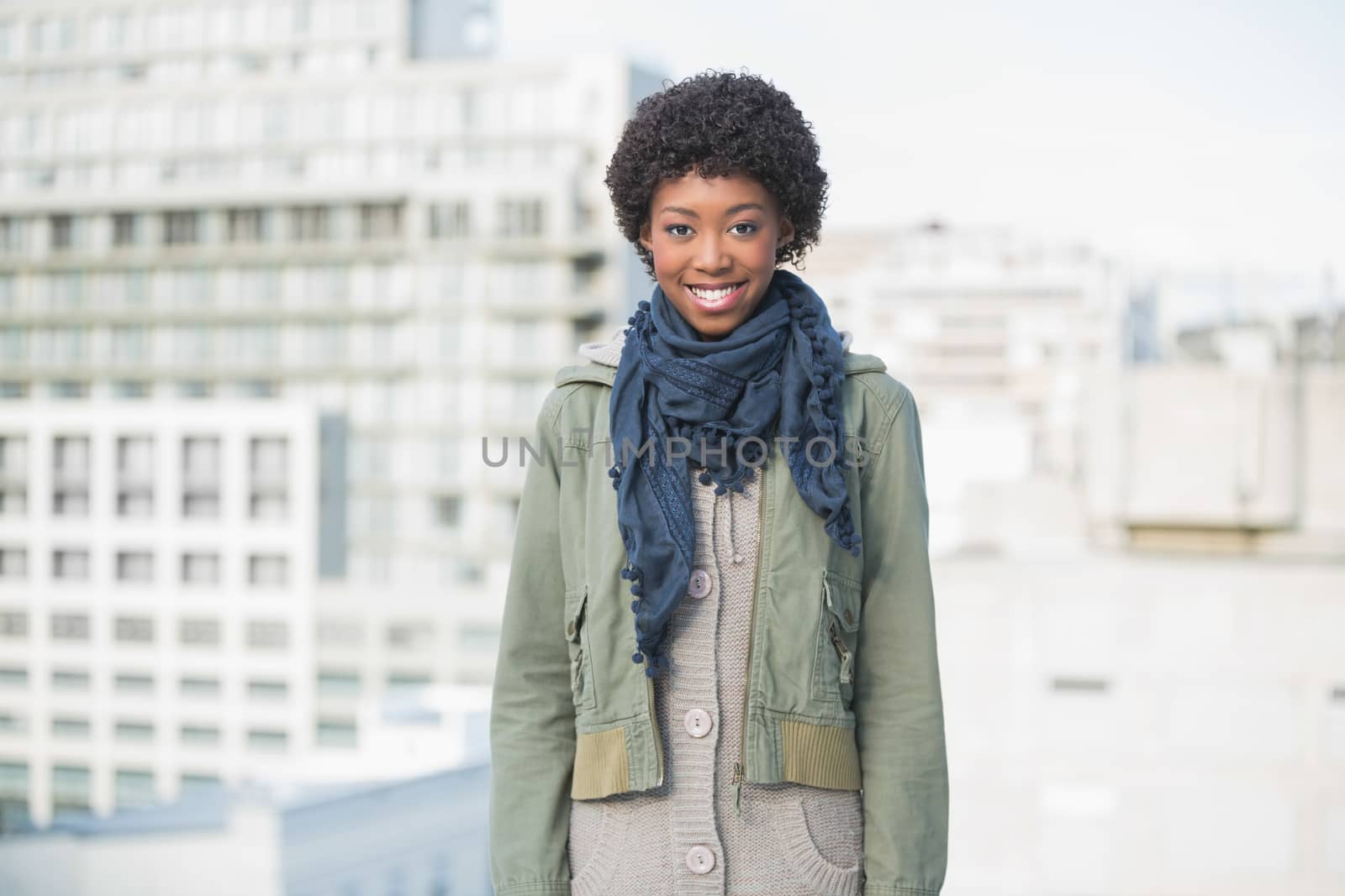 Smiling gorgeous woman posing outdoors by Wavebreakmedia