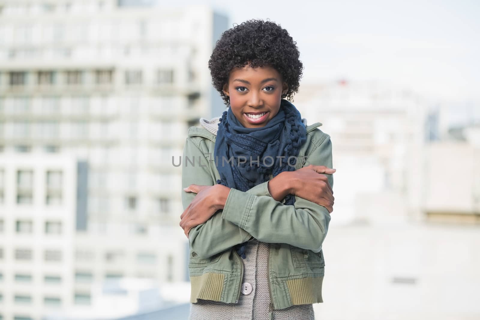 Shivering casual woman posing outdoors on a sunny day