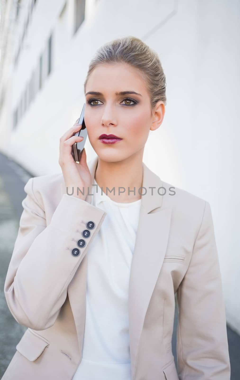 Thoughtful attractive businesswoman on the phone by Wavebreakmedia