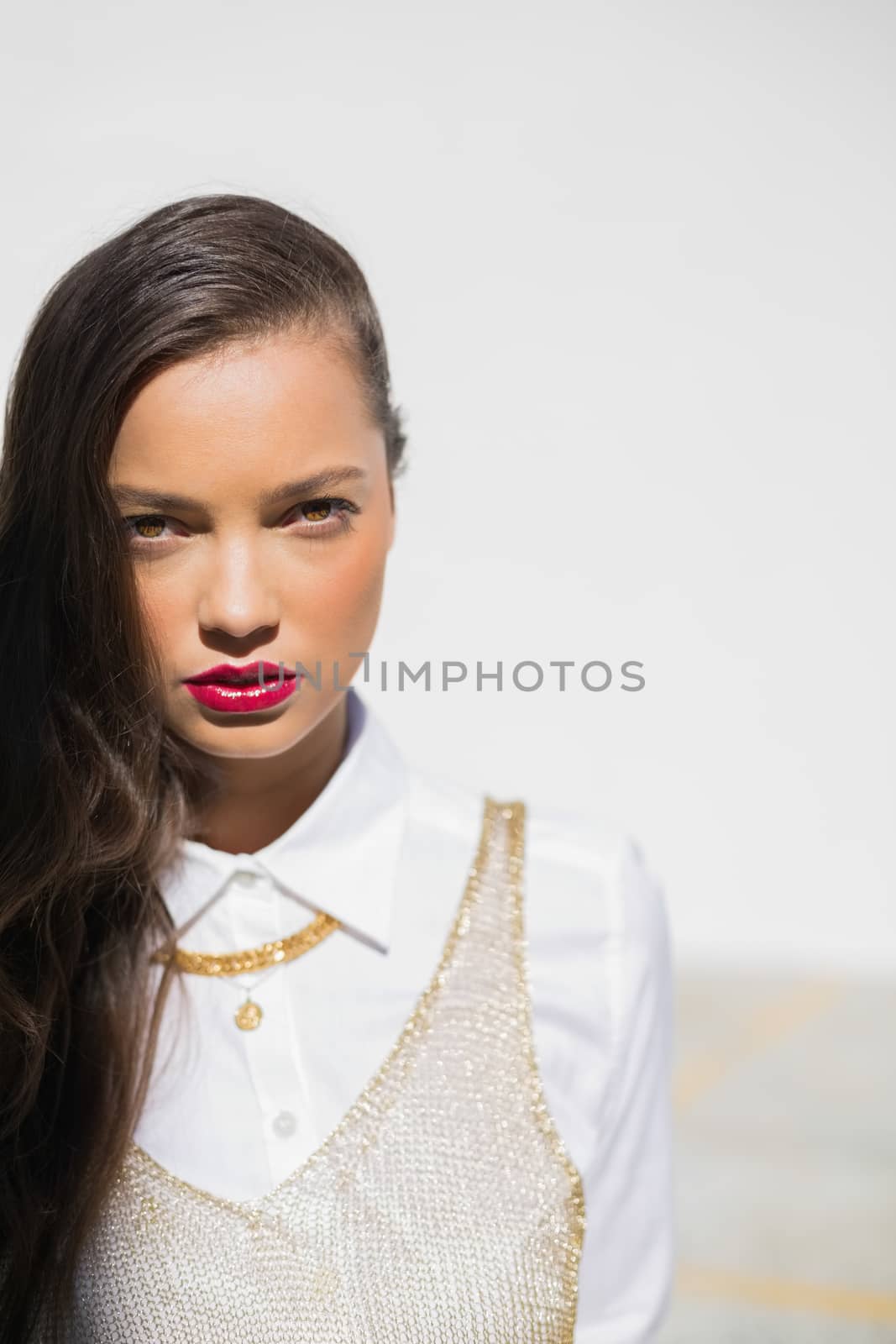 Pretty glamorous model with red lips  by Wavebreakmedia