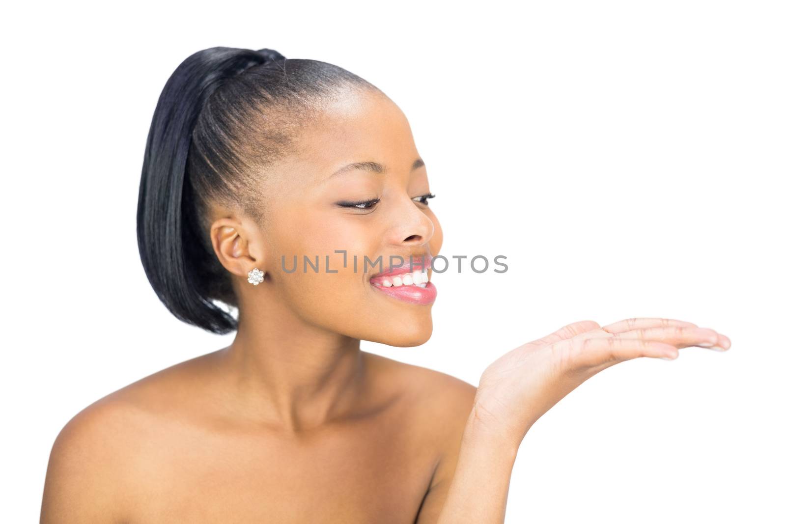 Dark beauty holding hand out in presentation on white background