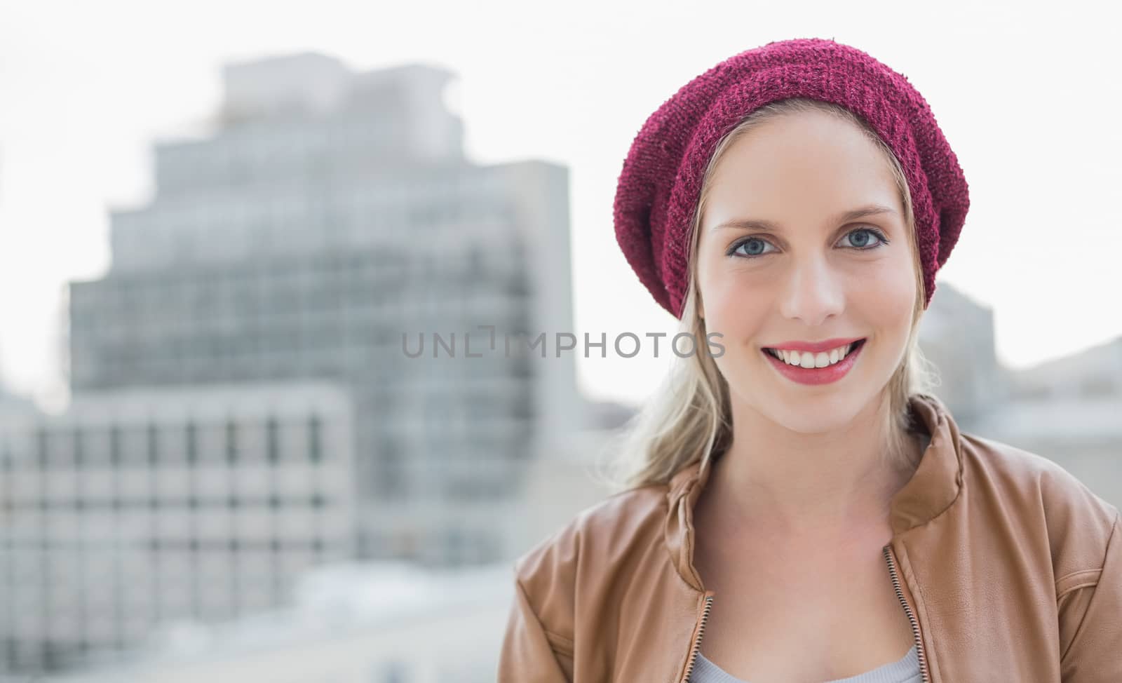 Cheerful casual blonde posing outdoors by Wavebreakmedia