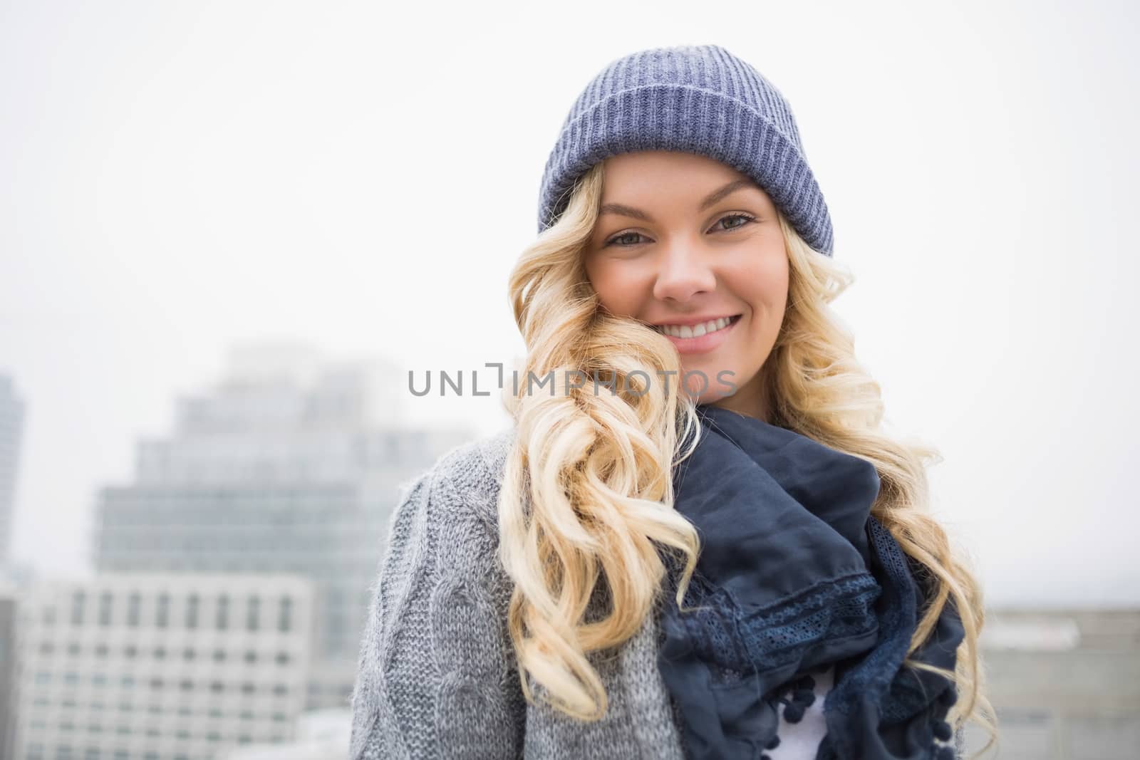 Happy gorgeous blonde posing outdoors by Wavebreakmedia