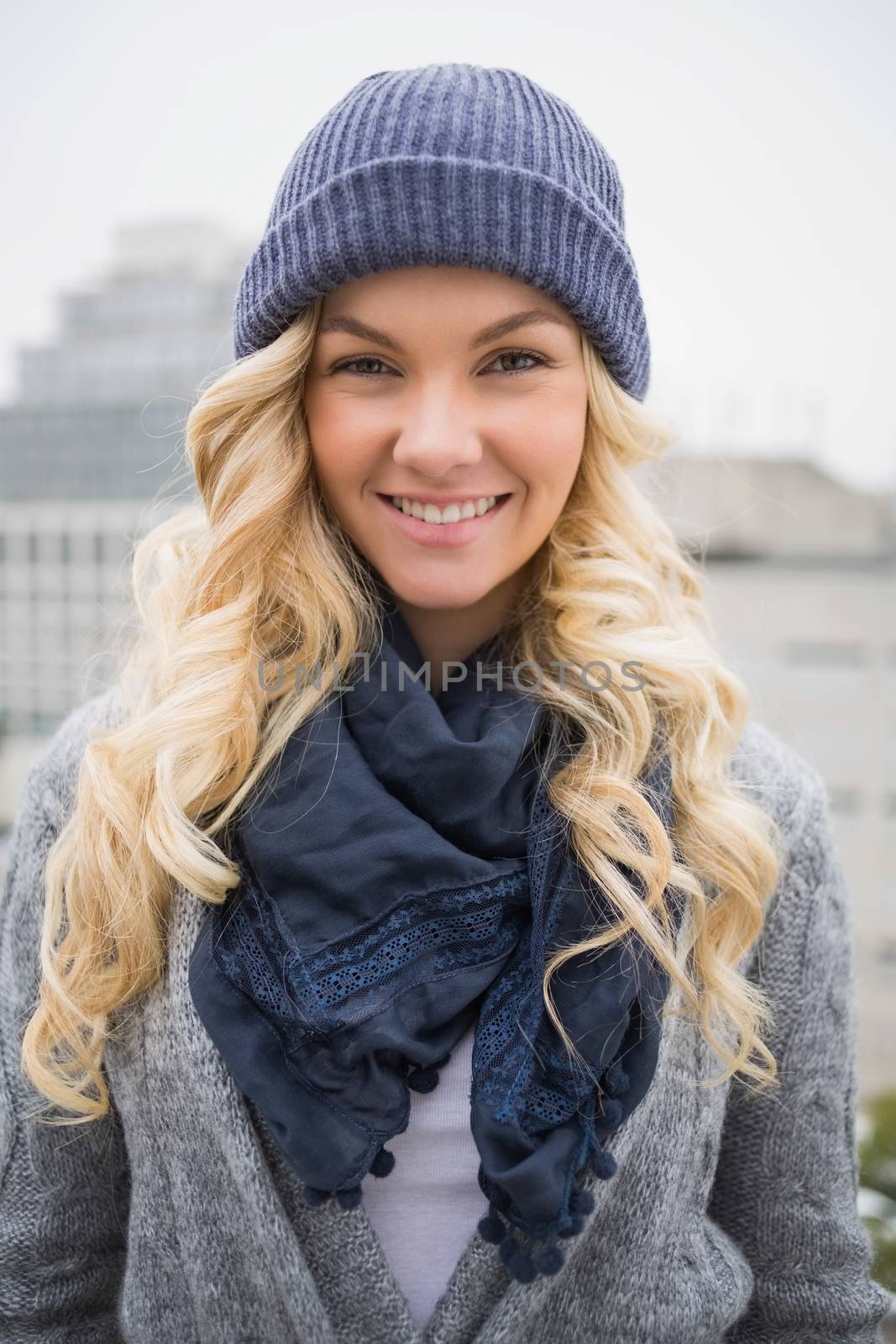 Cheerful pretty blonde posing outdoors by Wavebreakmedia