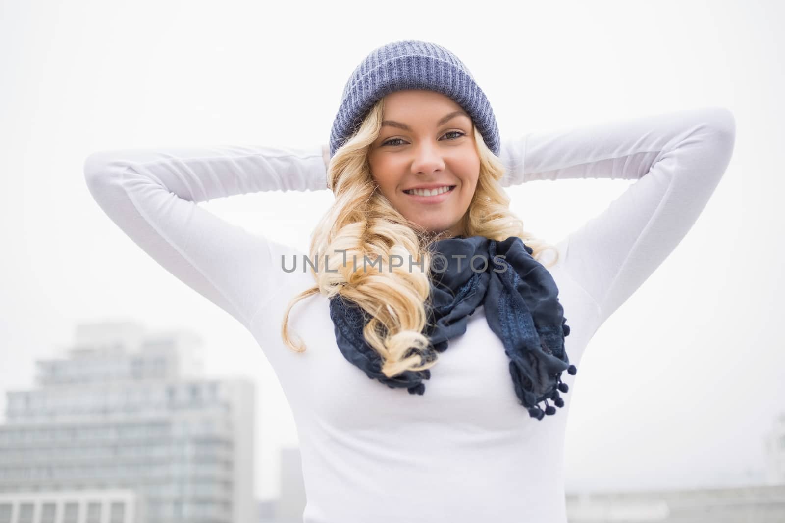 Cheerful gorgeous blonde posing outdoors by Wavebreakmedia