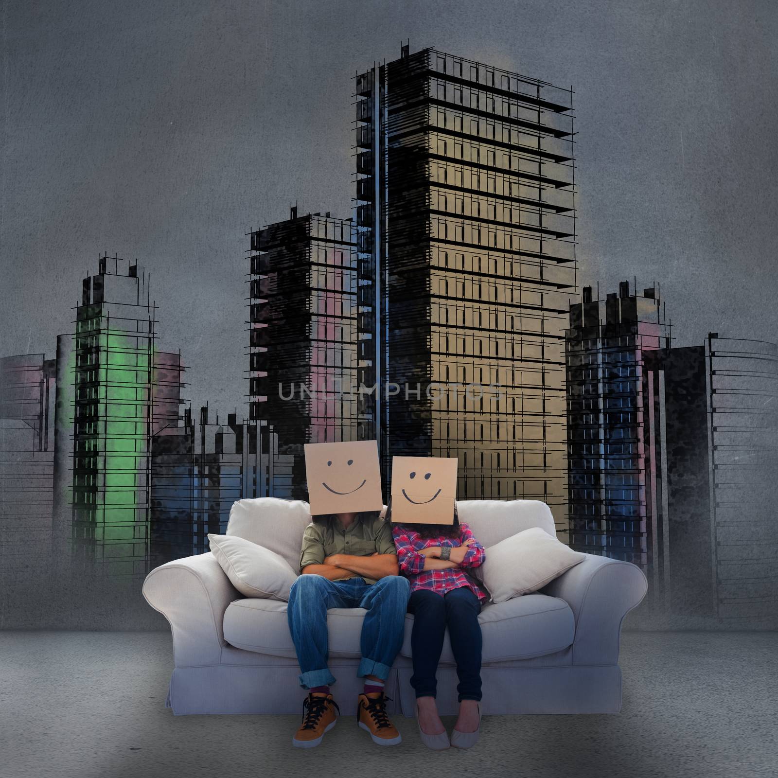 Couple sitting on couch in front of painted city by Wavebreakmedia