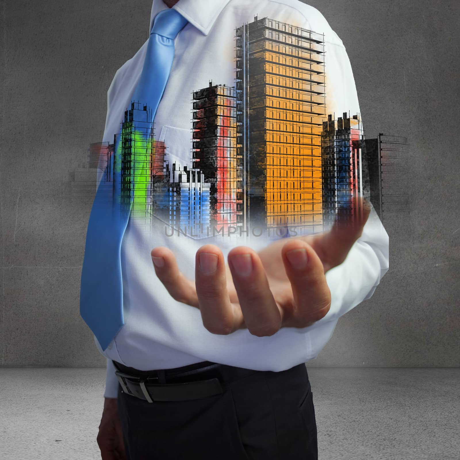 Close up of hand showing colorful holographic city in grey room