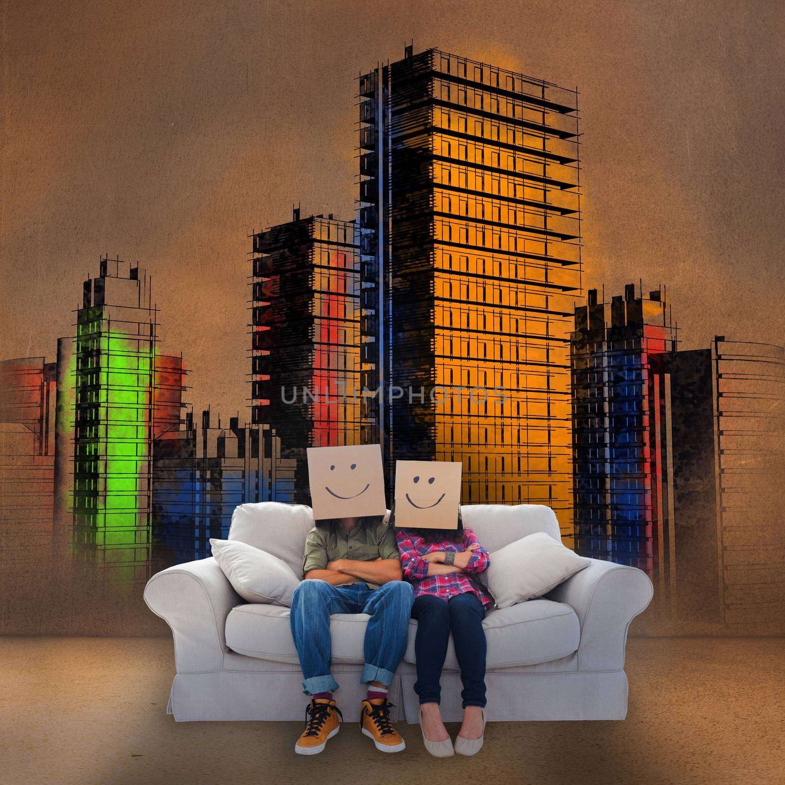 Couple sitting on couch in front of colored painted city by Wavebreakmedia