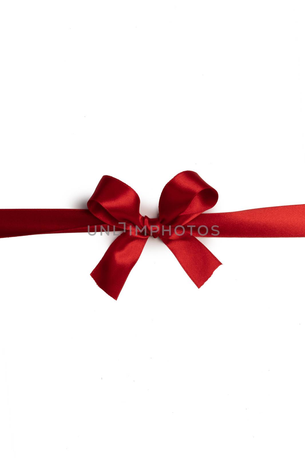 Red bow isolated on white by Yellowj