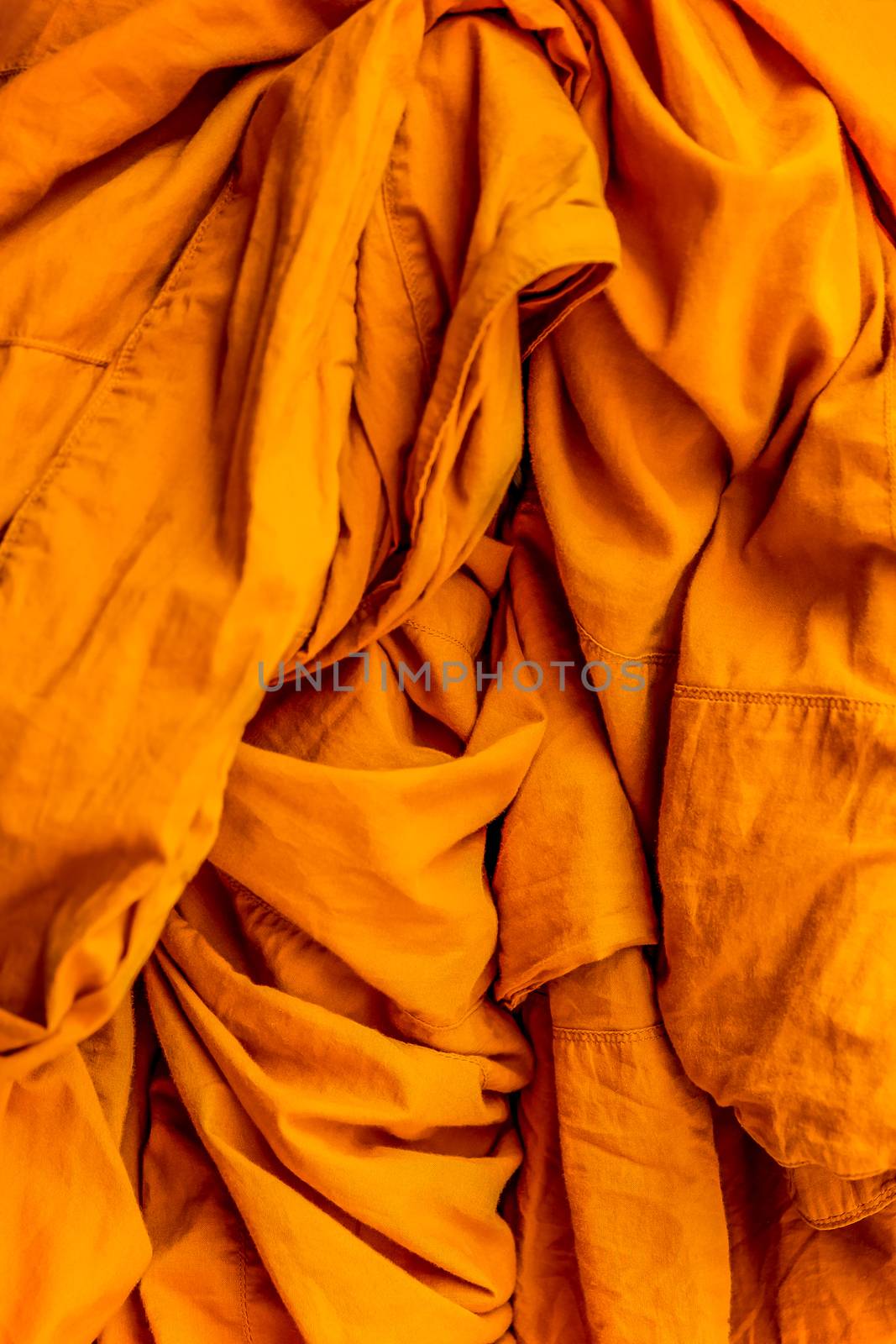 Yellow robe of Buddhist monks, Closeup on buddhist monk