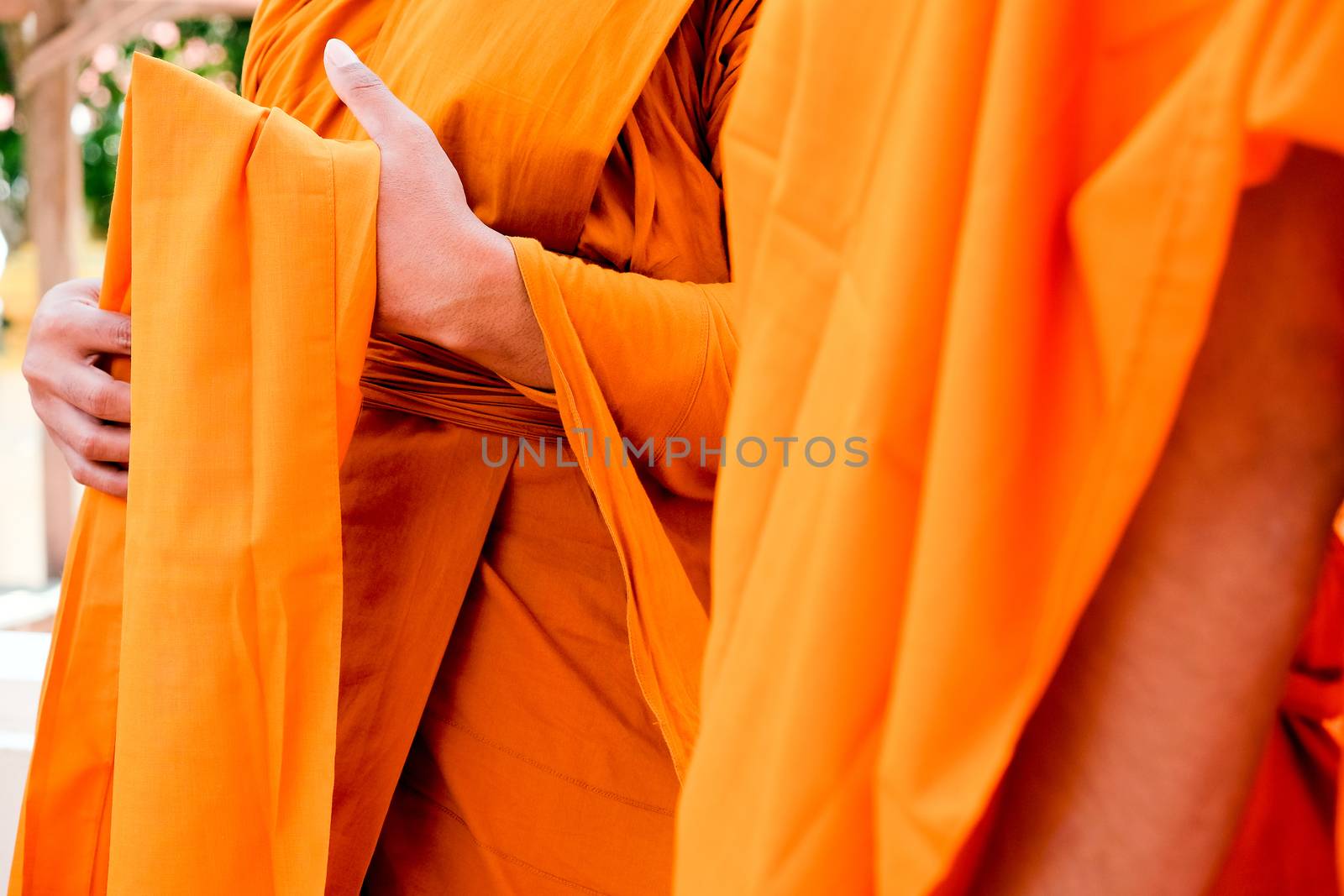 Yellow robe of Buddhist monks, Closeup on buddhist monk