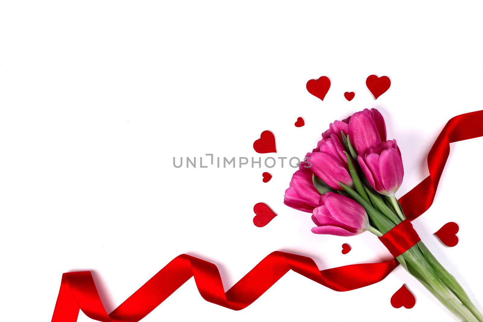 Valentines day hearts and pink tulip flowers isolated on white background