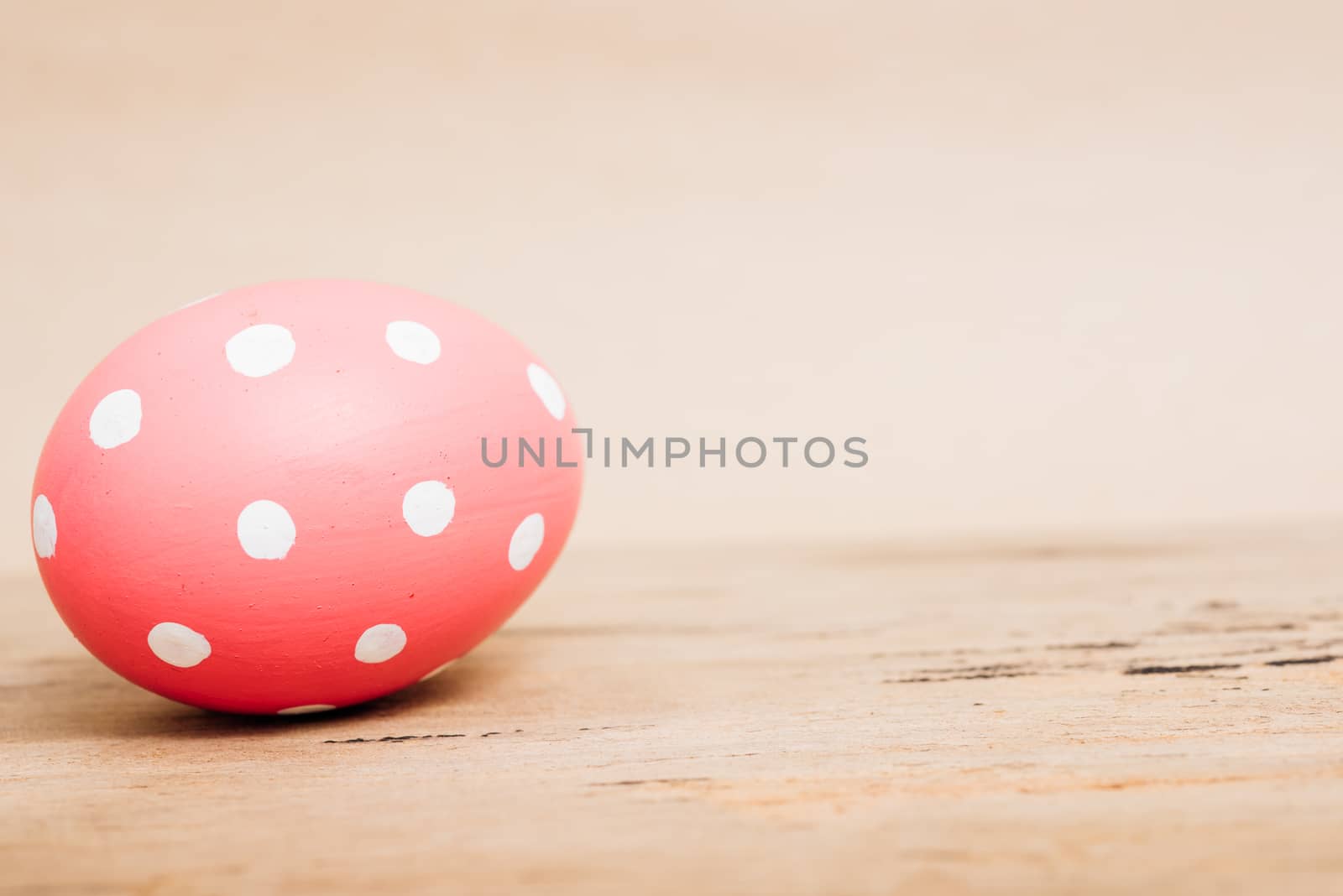 Beautiful Easter Pink egg on wooden background, Easter day concept