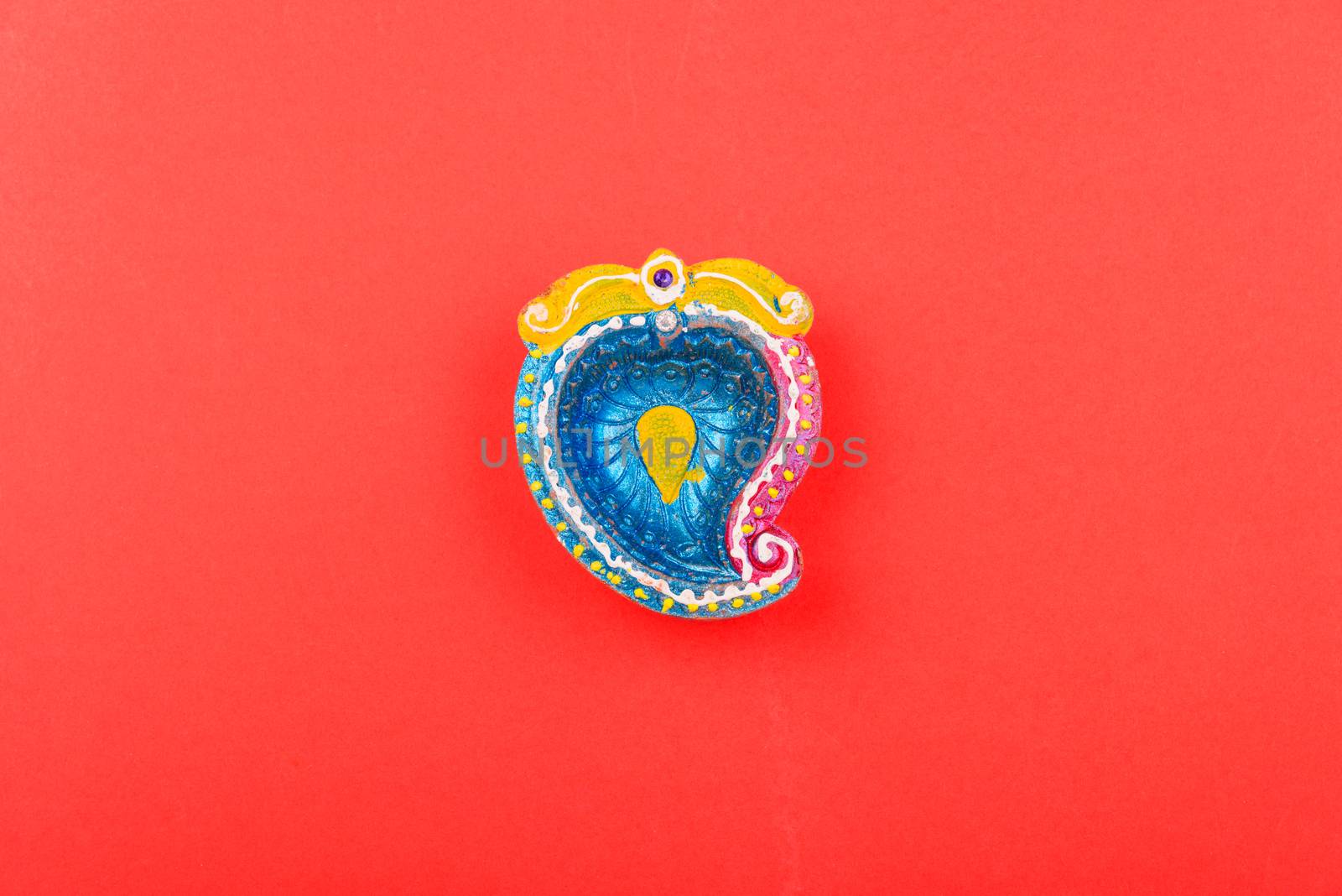 Happy Diwali Day, Flat lay top view Colorful Clay Diya lamps on red background and copy space for your text