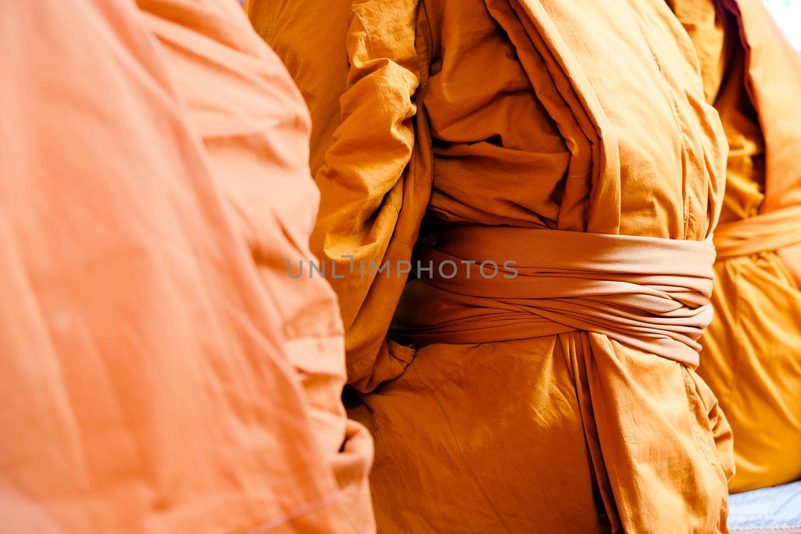 Yellow robe of Buddhist monks, Closeup on buddhist monk