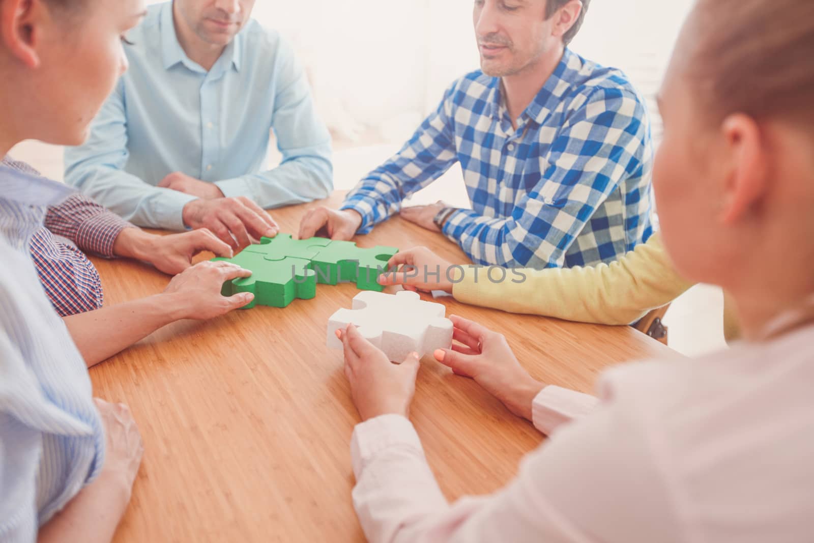 Hipster business successful teamwork concept, business people group assembling jigsaw puzzle
