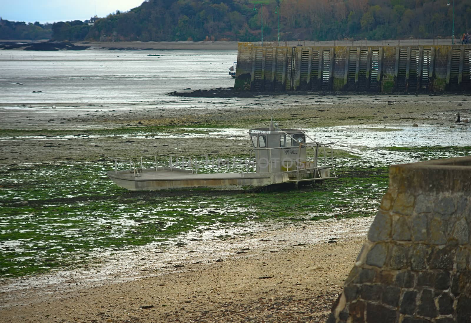 Fishing boat on beach during low tide at Cancale, France by sheriffkule