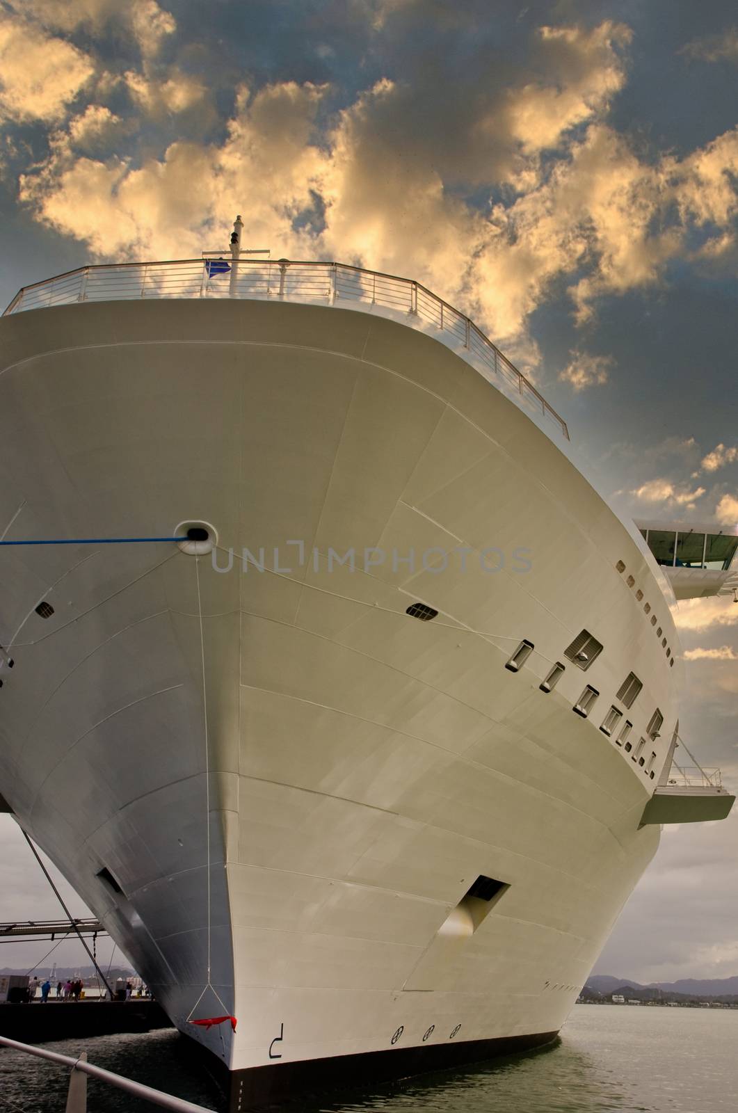 A cruise ship tied up at a dock