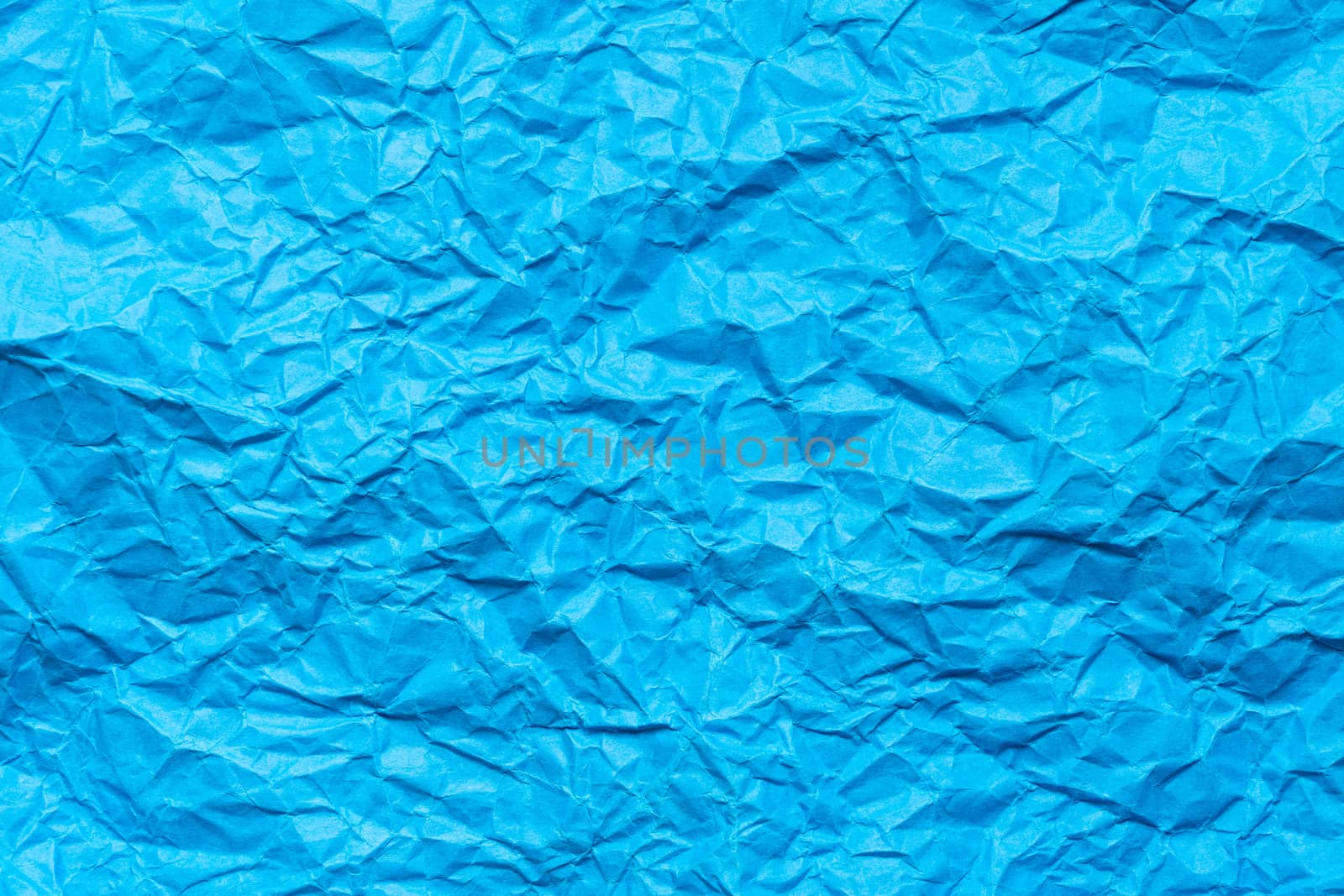 Blue crumpled paper background by Kenishirotie