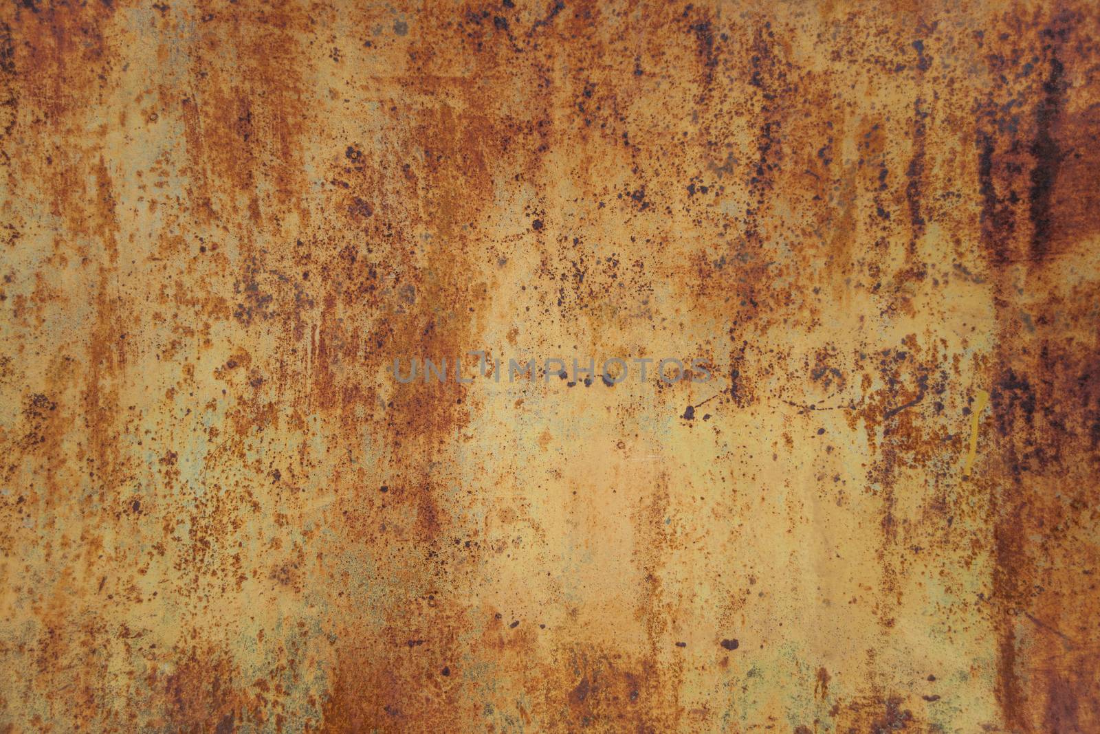 Brown background: old metal surface with orange paint and creased texture