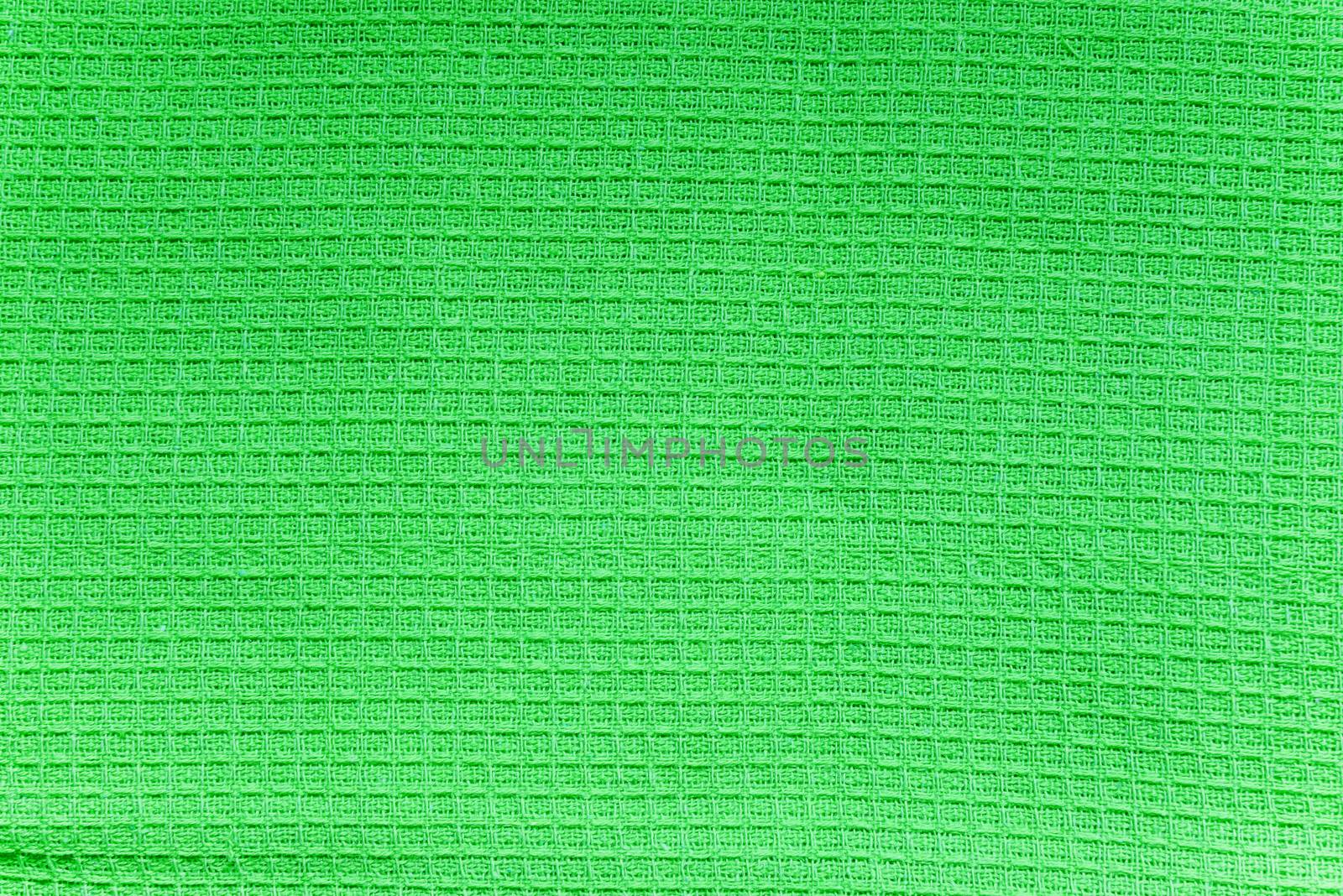Texture of green cotton waffle towels closeup
