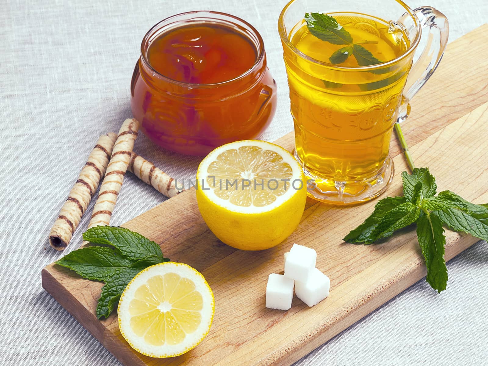 Tea with lemon min jam and cookies