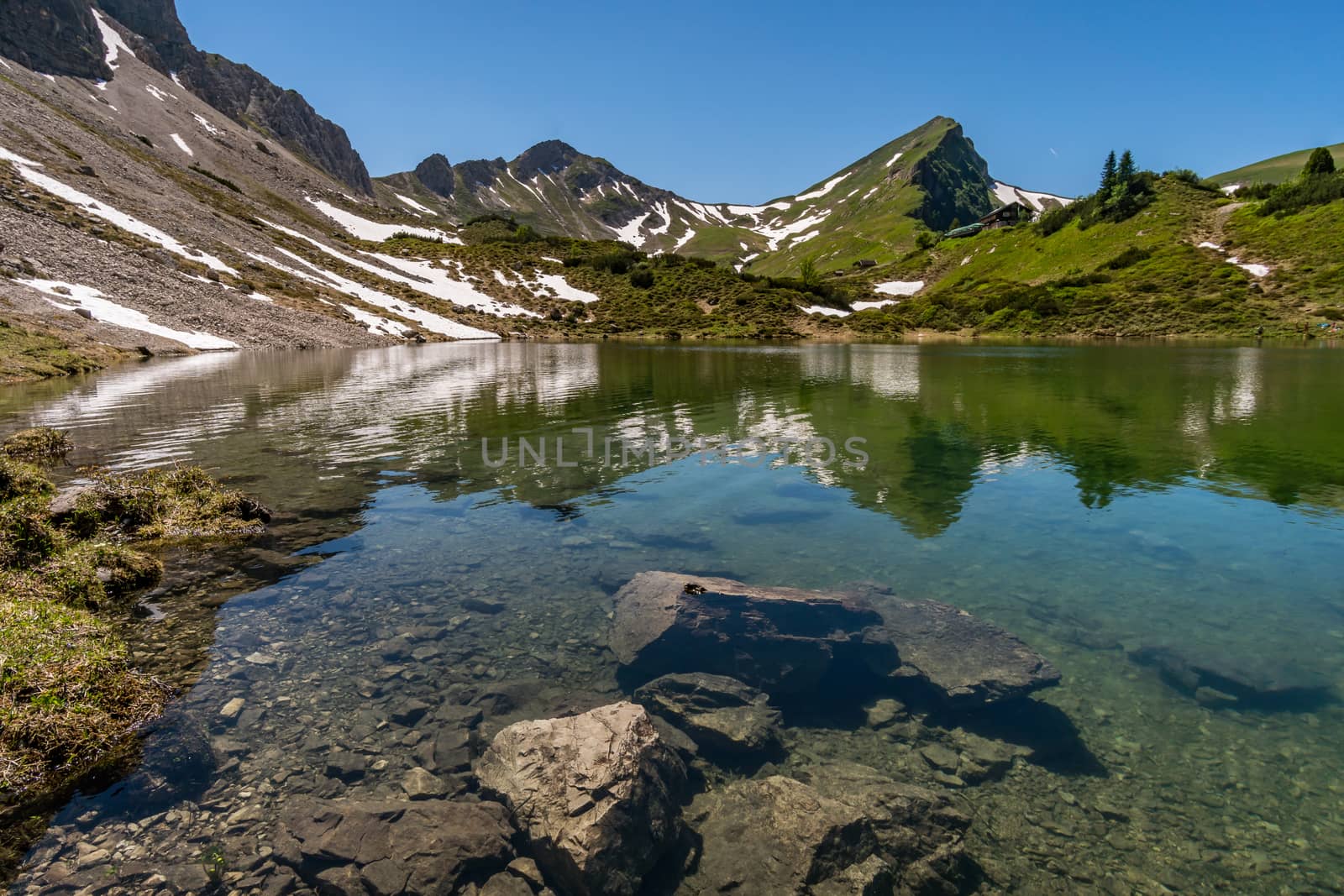 Fantastic hike in the Tannheim Mountains from the summit of Neunerkopfle over Landsberger hut to the beautiful Vilsalpsee.