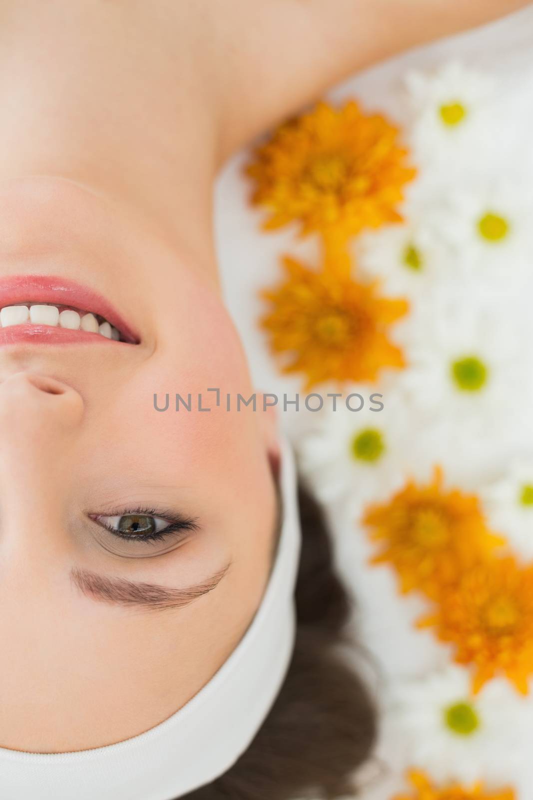 Beautiful woman with flowers in beauty salon by Wavebreakmedia