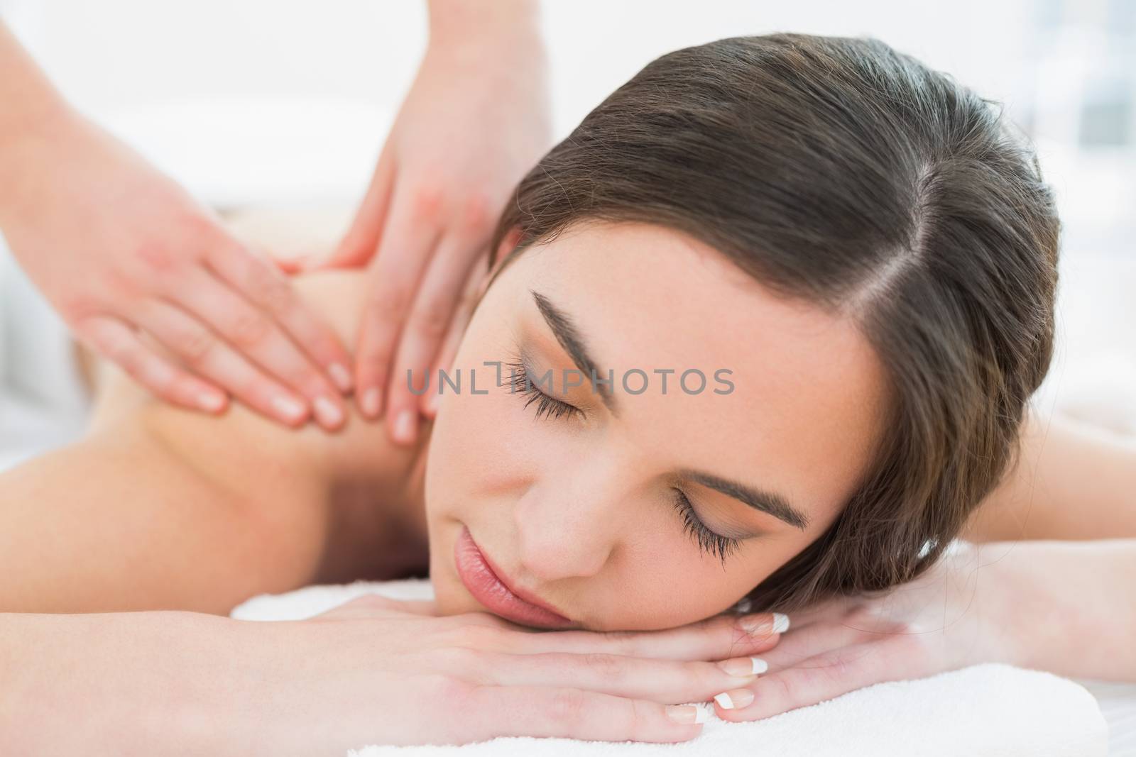 Beautiful woman enjoying shoulder massage at beauty spa by Wavebreakmedia