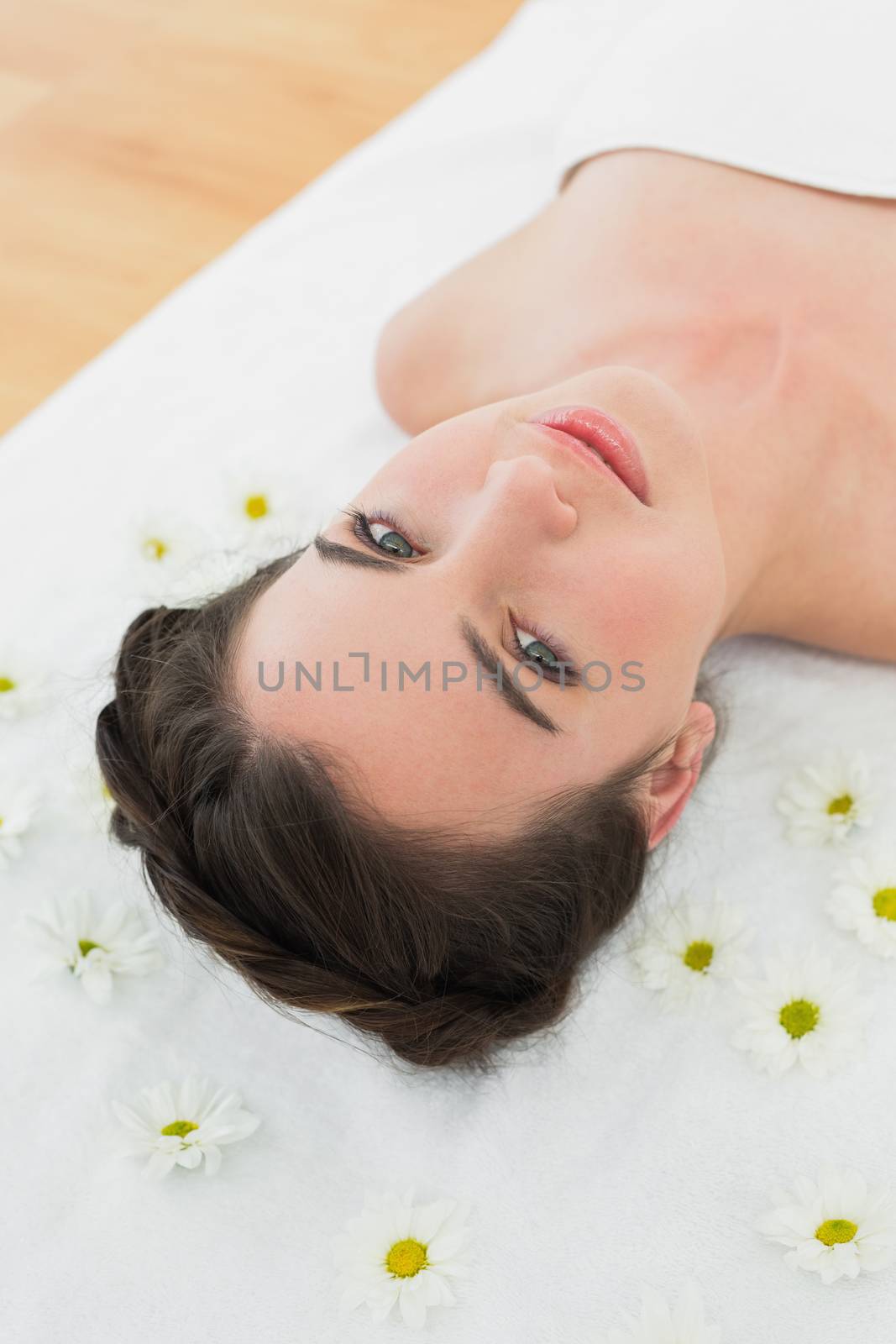 Beautiful woman with flowers in beauty salon by Wavebreakmedia