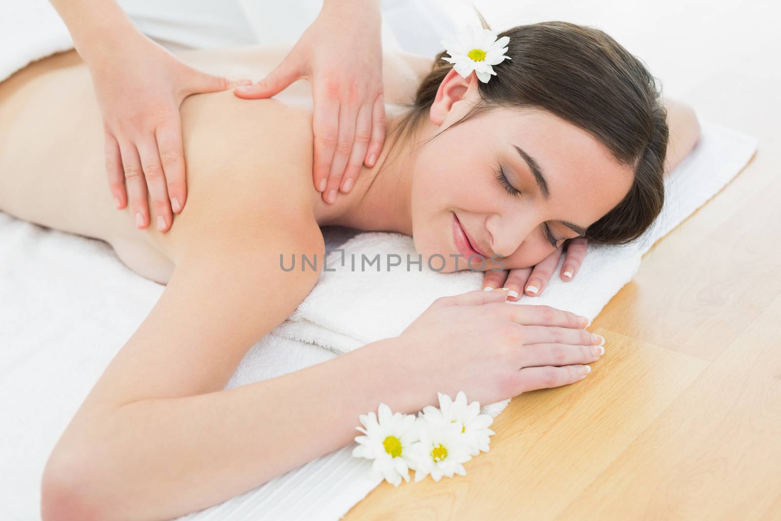 Beautiful woman enjoying back massage at beauty spa by Wavebreakmedia