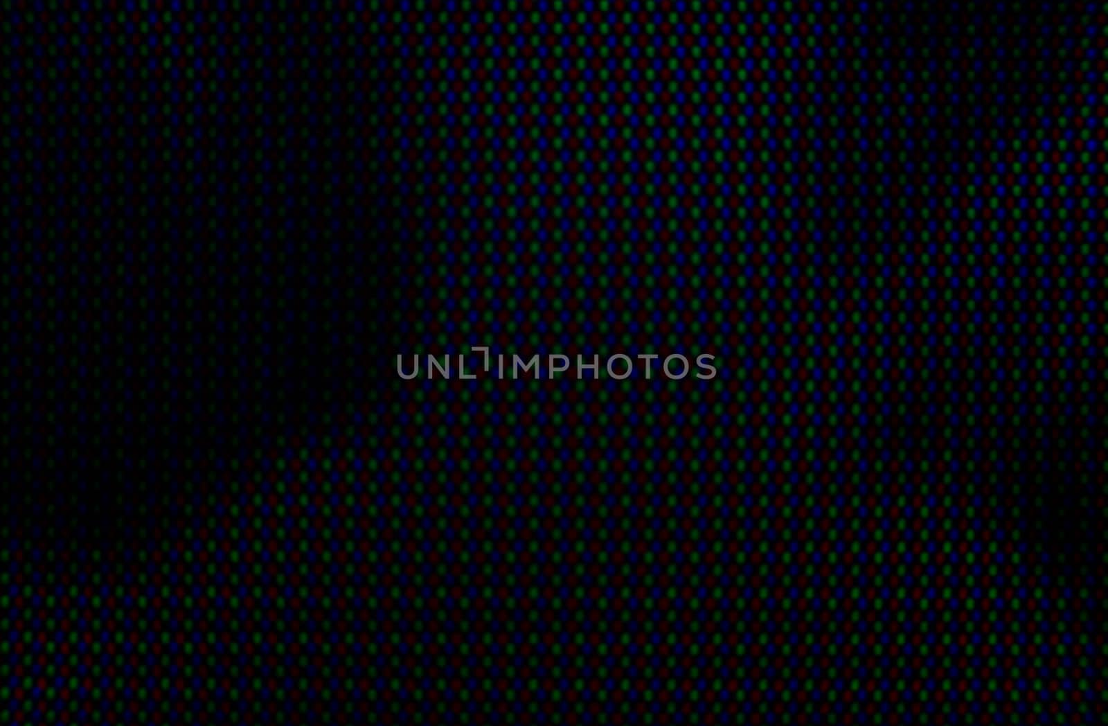 abstract background pattern of colored blurry dots on a dark background close up