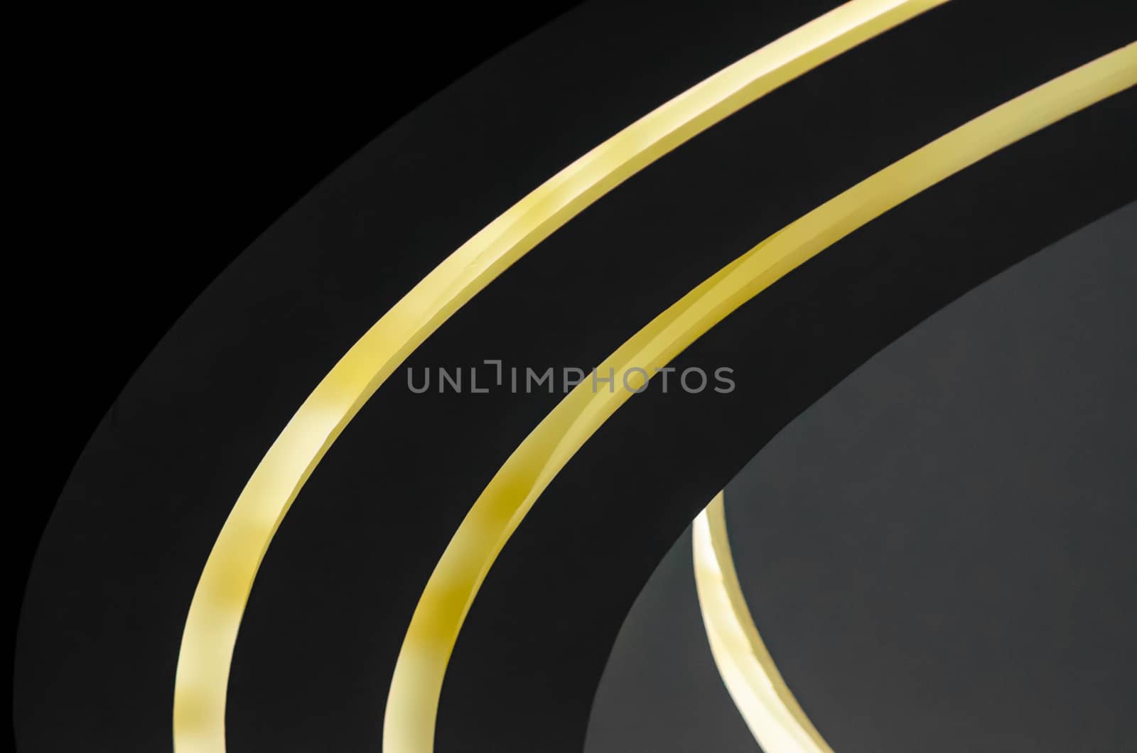 part of a modern building with lighting abstract background shades of gray and yellow curved lines