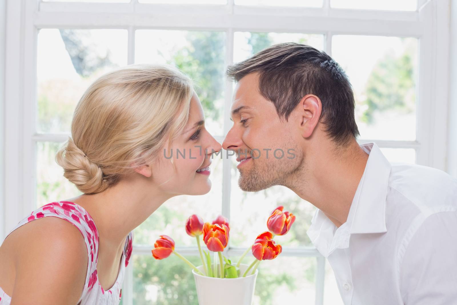 Side view of a romantic couple rubbing noses by Wavebreakmedia